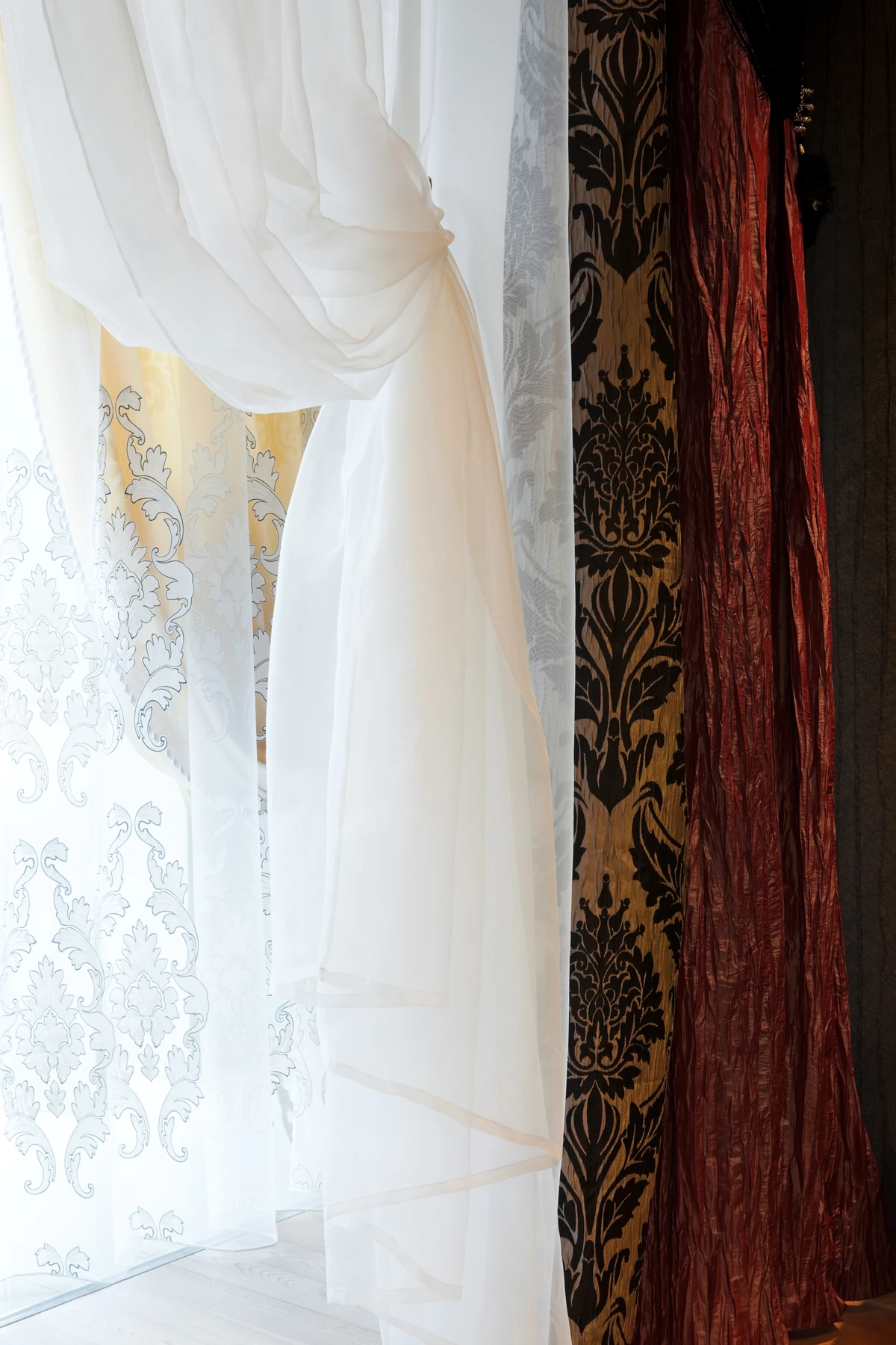 Custom fabric curtains with ornamental detail - The Window Designers