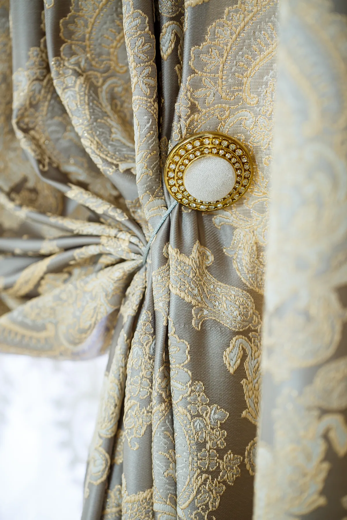 Ornate curtain tieback detail by Denver curtain designers